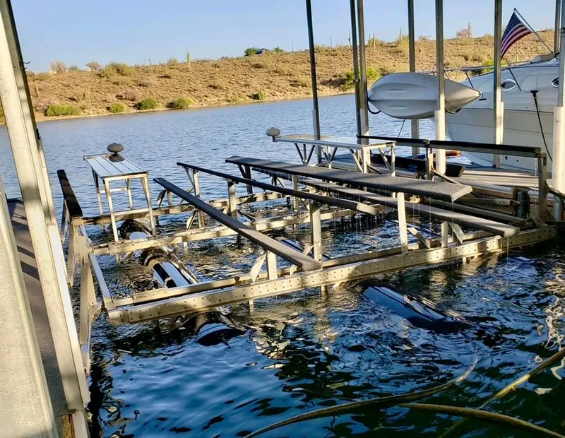 Slide: The Image of Boat lift at a lakeside dock, ready for a 1988 Warlock 37 Cat Cruiser. - 25