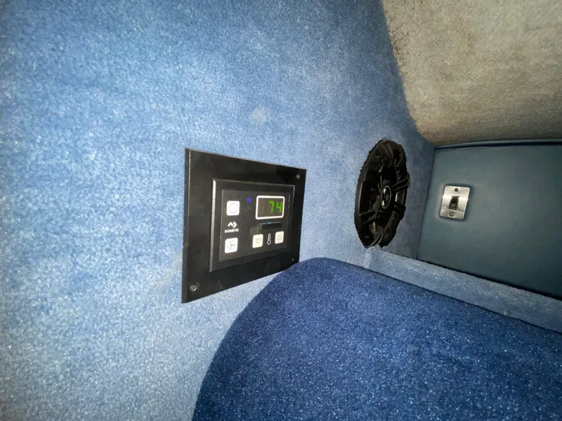 Slide: The Image of Control panel and speaker inside 1988 Warlock 37 Cat Cruiser boat. - 30