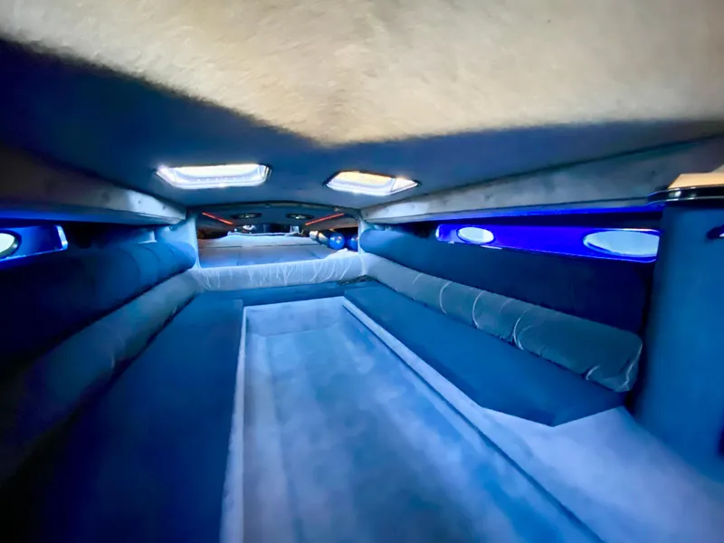 Slide: The Image of Interior cabin of a 1988 Warlock 37 Cat Cruiser with blue lighting. - 39