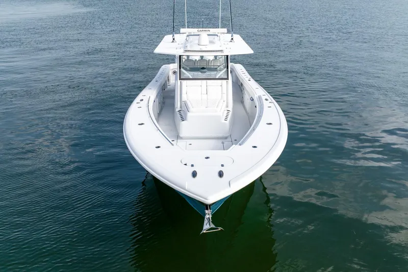 Slide: The Image of 2024 Yellowfin 42 boat on calm water, front view. - 10