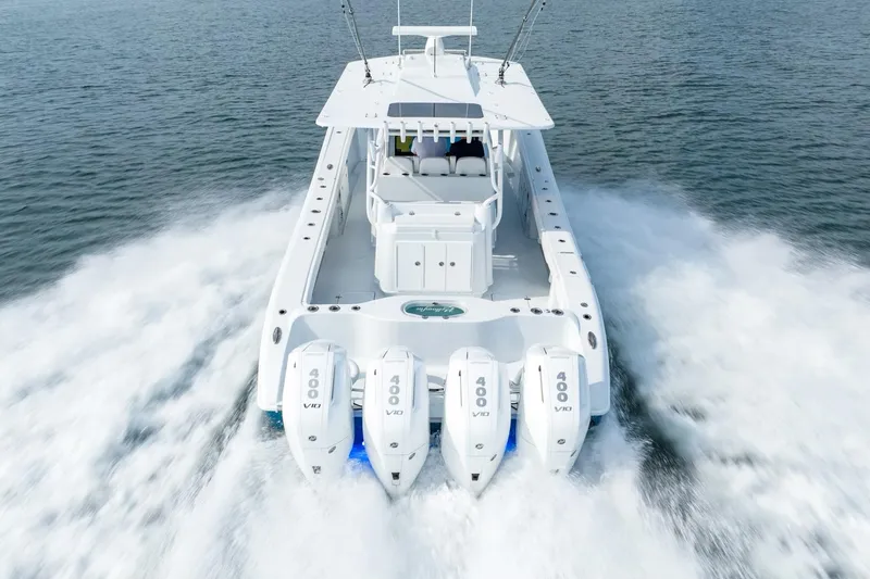 Slide: The Image of 2024 Yellowfin 42 boat with quad 400 V8 engines cruising on water. - 11