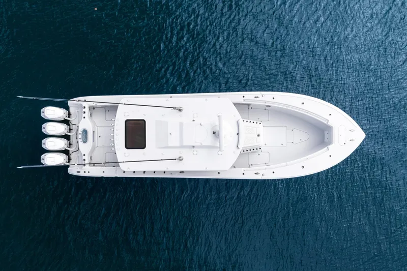 Slide: The Image of Top view of 2024 Yellowfin 42 boat on blue water. - 13