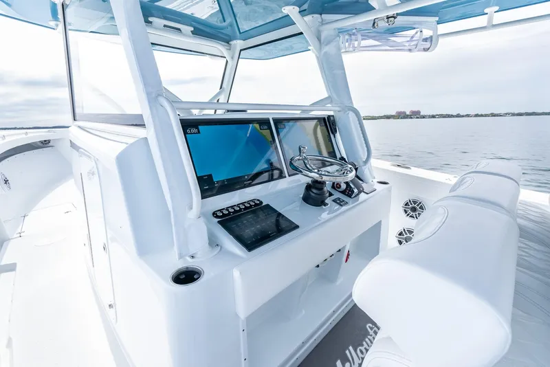 Slide: The Image of 2024 Yellowfin 42 boat helm station with modern navigation equipment. - 17
