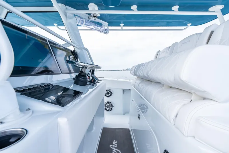 Slide: The Image of 2024 Yellowfin 42 boat interior with modern helm and seating. - 18