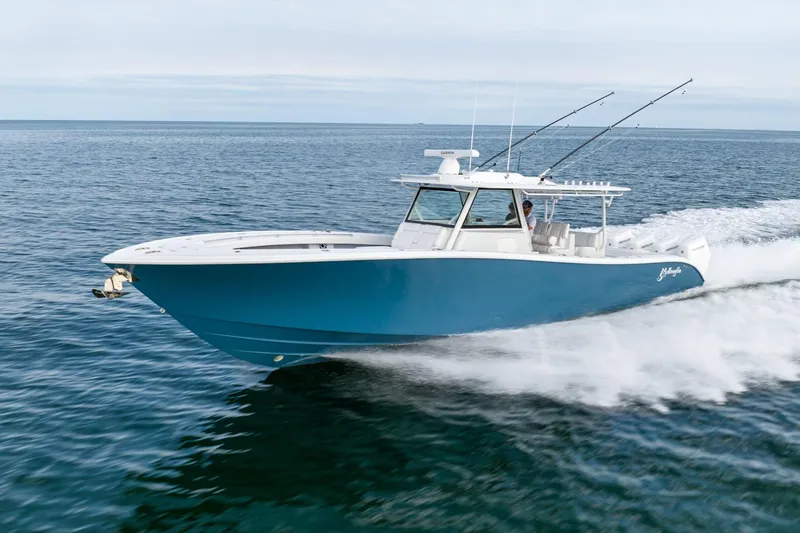 Slide: The Image of 2024 Yellowfin 42 boat cruising on open water. - 2