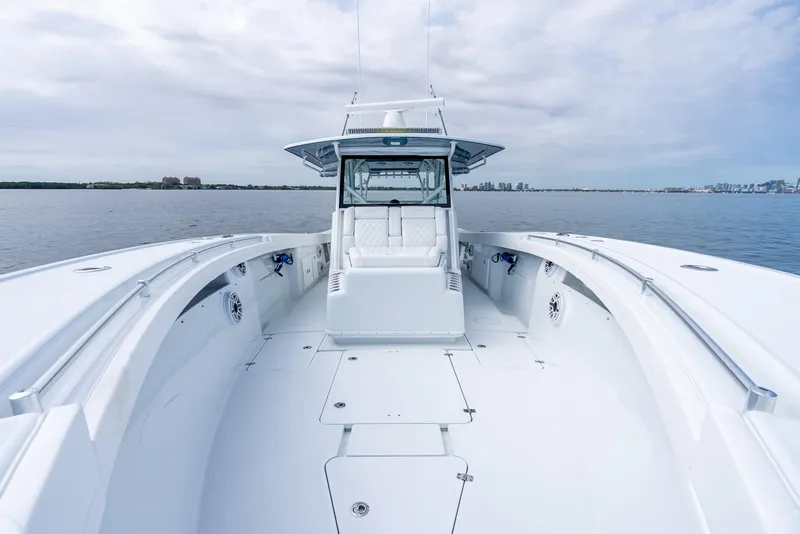 Slide: The Image of 2024 Yellowfin 42 boat on calm water with spacious deck and modern design. - 27