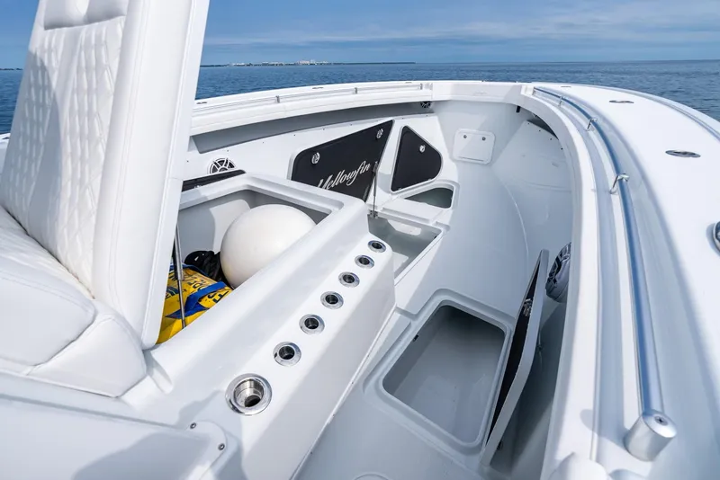 Slide: The Image of 2024 Yellowfin 42 boat interior with storage compartments and seating. - 29