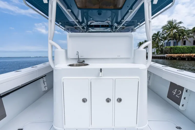 Slide: The Image of 2024 Yellowfin 42 boat interior with sink and storage cabinets. - 31