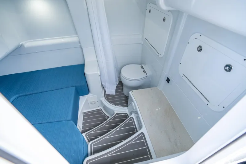 Slide: The Image of 2024 Yellowfin 42 boat interior with toilet and seating area. - 43