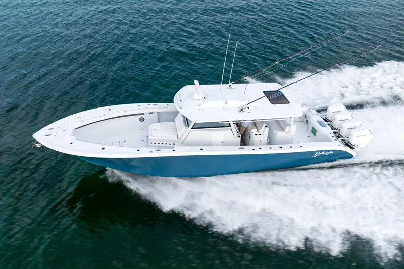Slide: The Image of 2024 Yellowfin 42 boat cruising on open water. - 8