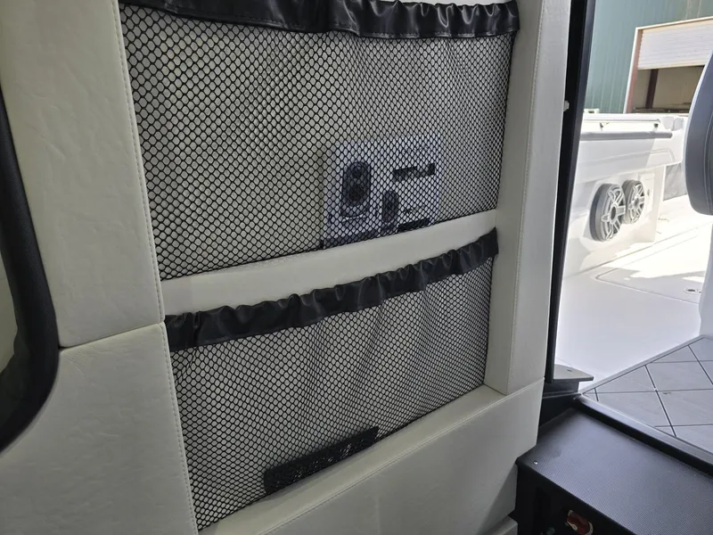 Slide: The Image of Interior view of 2024 Nor-Tech 452 Super Fish boat with storage netting. - 11