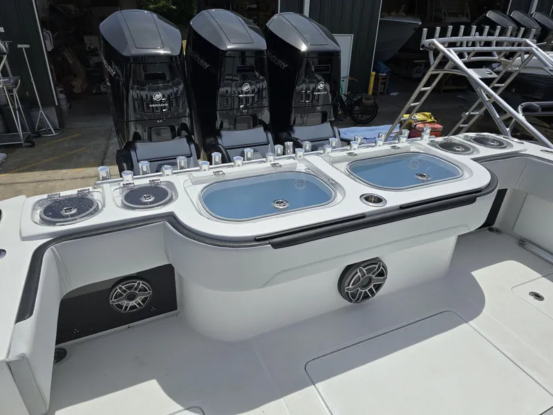 Slide: The Image of 2024 Nor-Tech 452 Super Fish boat with Mercury Verado engines and live bait wells. - 16