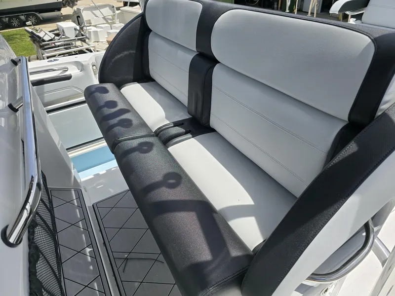 Slide: The Image of 2024 Nor-Tech 452 Super Fish boat seating area with black and white upholstery. - 19