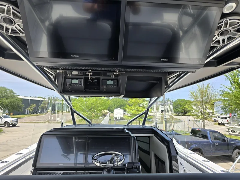 Slide: The Image of 2024 Nor-Tech 452 Super Fish helm with dual Garmin displays and advanced controls. - 20