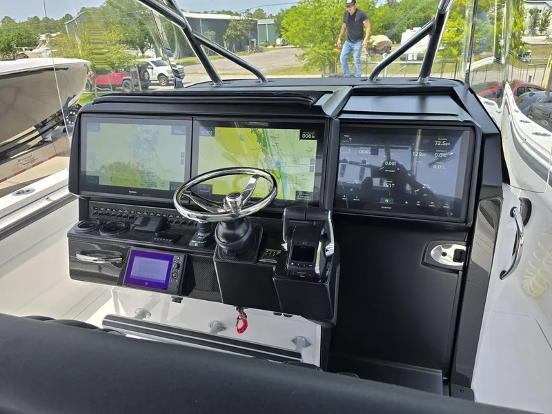 Slide: The Image of 2024 Nor-Tech 452 Super Fish boat dashboard with advanced navigation and control systems. - 22