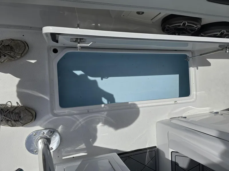 Slide: The Image of Open storage compartment on a 2024 Nor-Tech 452 Super Fish boat. - 24