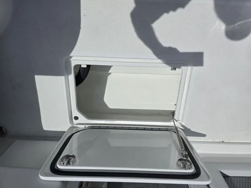 Slide: The Image of Open storage compartment on 2024 Nor-Tech 452 Super Fish boat. - 25