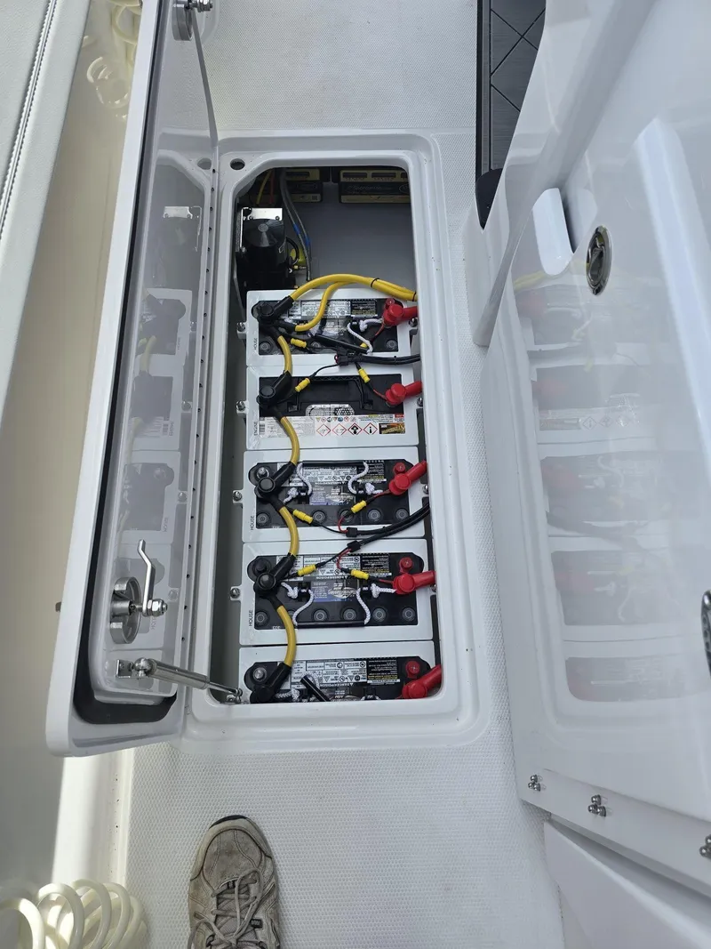 Slide: The Image of Battery compartment of 2024 Nor-Tech 452 Super Fish boat with wiring and connections. - 26