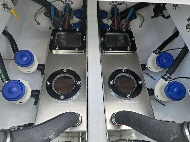 Slide: The Image of Engine compartment of 2024 Nor-Tech 452 Super Fish boat with fuel tanks and hoses. - 27