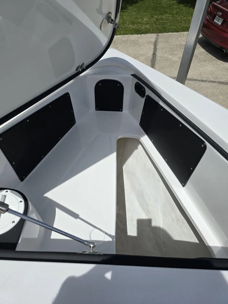 Slide: The Image of 2024 Nor-Tech 452 Super Fish storage compartment with open hatch. - 29