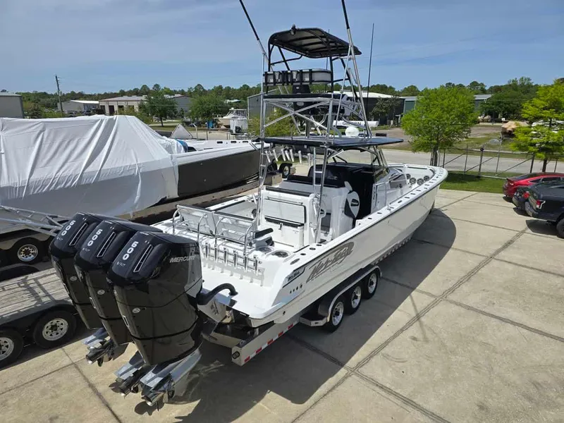 Slide: The Image of 2024 Nor-Tech 452 Super Fish boat with triple Mercury 450R outboard engines. - 3