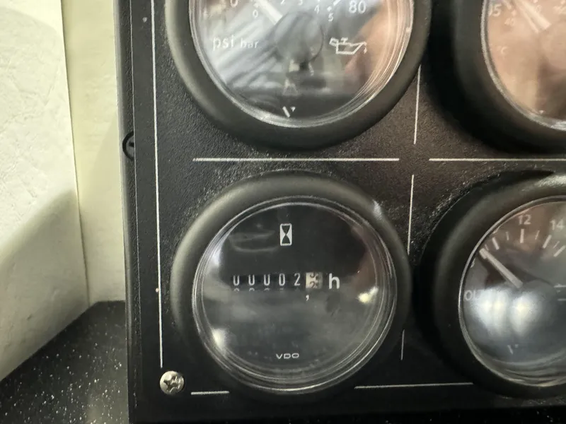 Slide: The Image of Close-up of 2024 Nor-Tech 452 Super Fish boat dashboard gauges. - 33