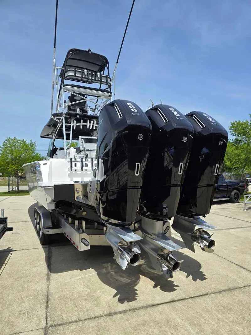 Slide: The Image of 2024 Nor-Tech 452 Super Fish boat with triple outboard engines. - 6