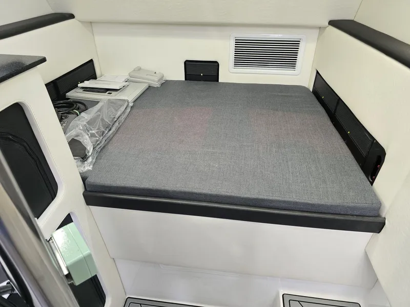Slide: The Image of Interior cabin of 2024 Nor-Tech 452 Super Fish with bed and storage compartments. - 7