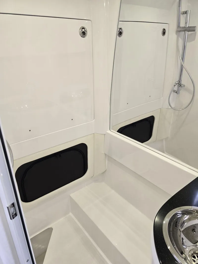Slide: The Image of Interior of 2024 Nor-Tech 452 Super Fish boat with shower and sink. - 8
