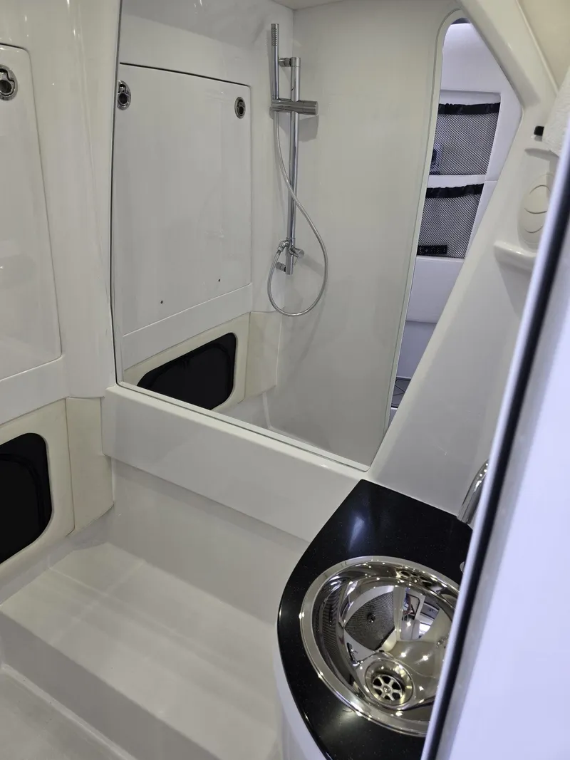 Slide: The Image of 2024 Nor-Tech 452 Super Fish bathroom with modern shower and sink. - 9