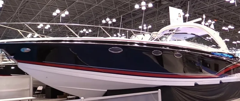 Slide: The Image of 2015 Formula 400 FX8 luxury boat displayed at an indoor boat show. - 15