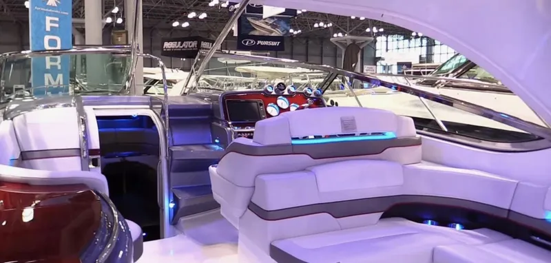 Slide: The Image of Interior of a 2015 Formula 400 FX8 luxury boat with modern seating and dashboard. - 18