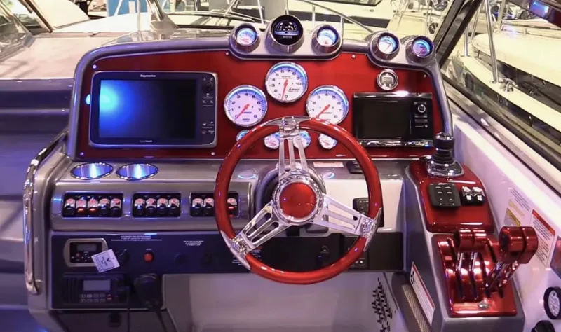 Slide: The Image of Control panel of a 2015 Formula 400 FX8 boat with red steering wheel and gauges. - 20
