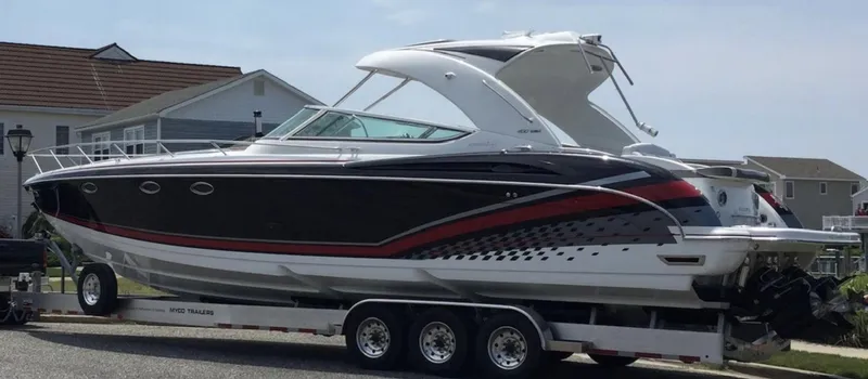 Slide: The Image of 2015 Formula 400 FX8 boat on a trailer in a residential area. - 3