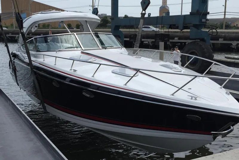 Slide: The Image of 2015 Formula 400 FX8 boat being lifted from water by crane. - 4