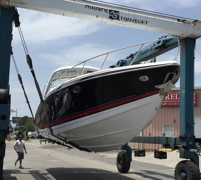 Slide: The Image of 2015 Formula 400 FX8 boat being lifted by Marine Travelift. - 8