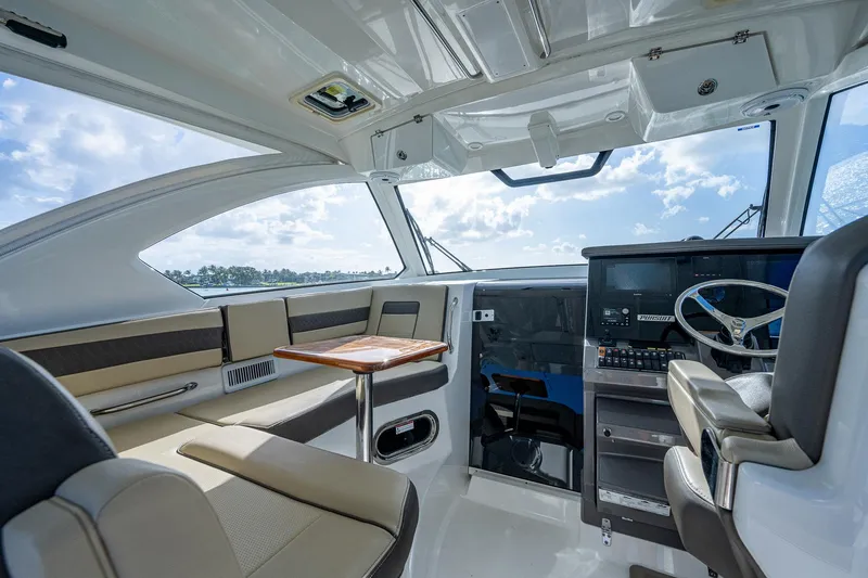 Slide: The Image of Interior of 2020 Pursuit OS 355 boat with modern seating and helm station. - 29