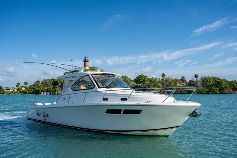 Slide: The Image of 2020 Pursuit OS 355 boat cruising on a sunny day. - 3