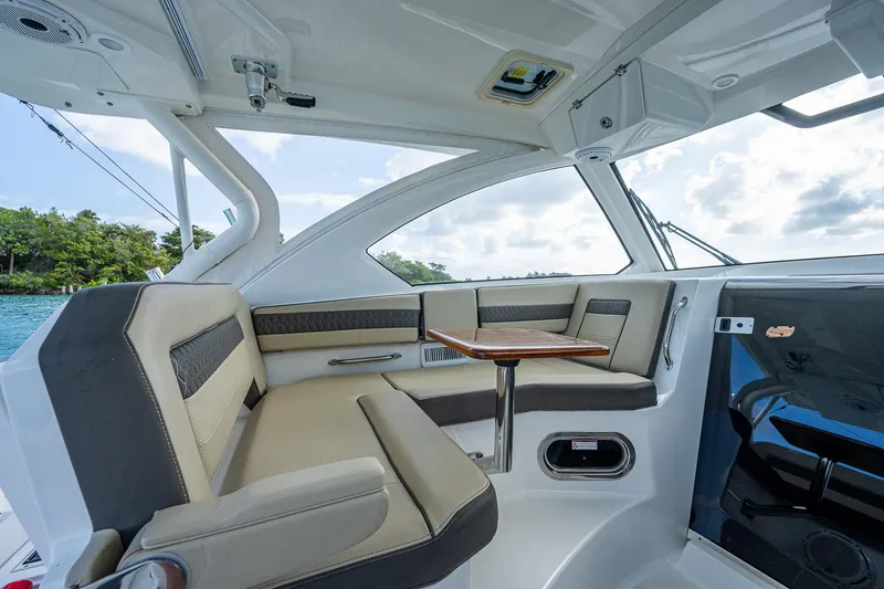 Slide: The Image of Interior of 2020 Pursuit OS 355 boat with seating and table. - 30