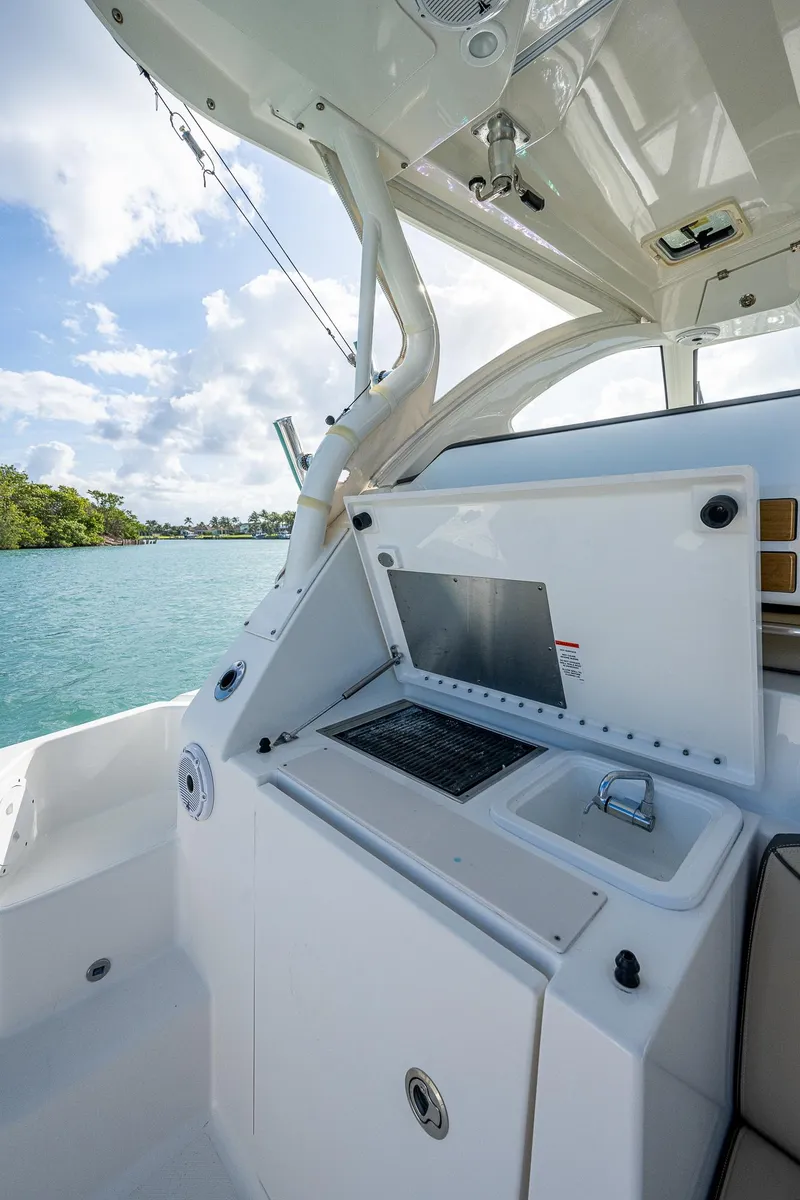 Slide: The Image of 2020 Pursuit OS 355 boat interior with a view of the water. - 33