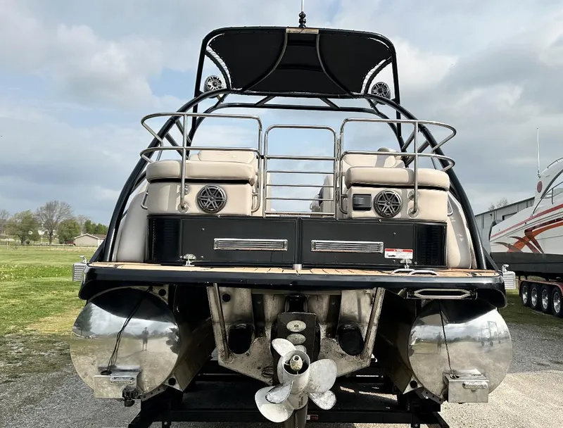 Slide: The Image of 2014 Bennington 2550 QSR pontoon boat rear view with dual propellers. - 3