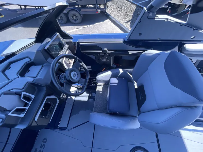Slide: The Image of 2024 Axis T250 boat cockpit with modern steering and seating. - 11