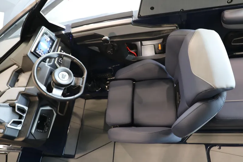 Slide: The Image of 2024 Axis T250 boat cockpit with modern steering and comfortable seating. - 13
