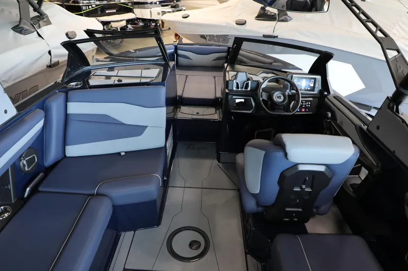 Slide: The Image of 2024 Axis T250 boat interior with modern seating and advanced dashboard controls. - 14