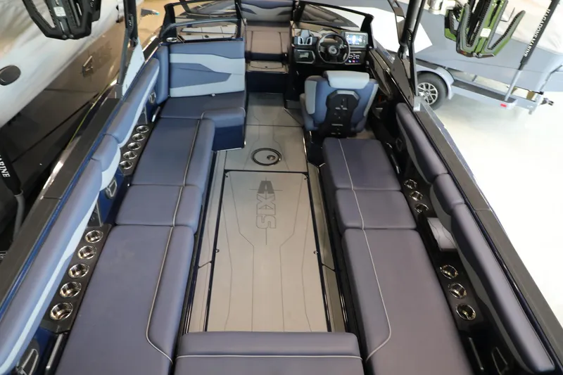 Slide: The Image of 2024 Axis T250 boat interior with spacious seating and modern dashboard. - 7