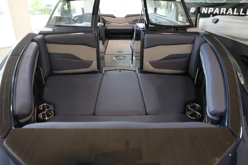 Slide: The Image of 2024 Axis T250 boat interior with luxurious seating and cup holders. - 8