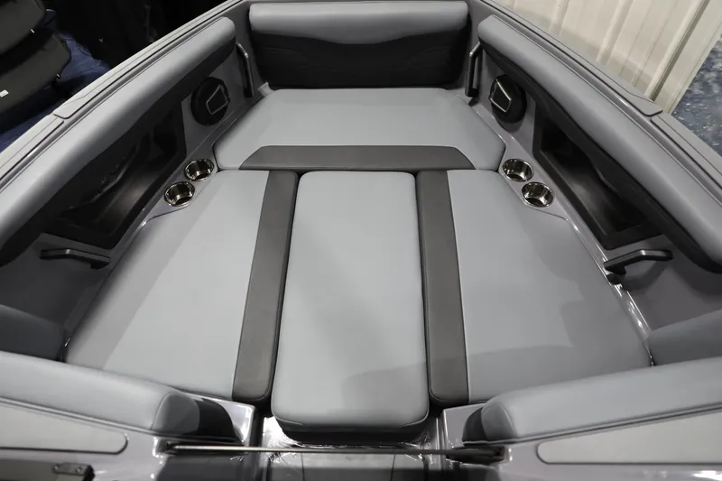 Slide: The Image of 2024 Axis T250 boat interior with gray seating and cup holders. - 10