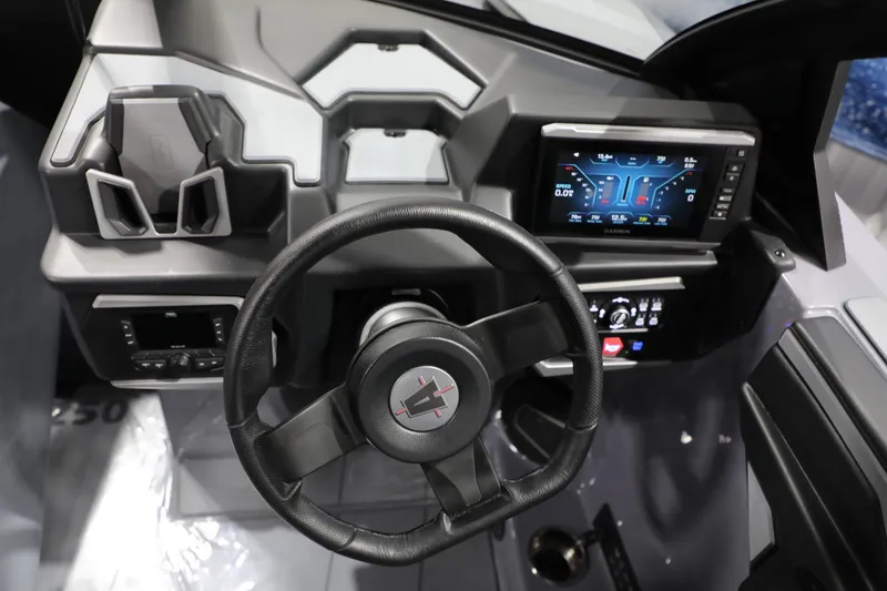 Slide: The Image of 2024 Axis T250 boat dashboard with steering wheel and digital display. - 14