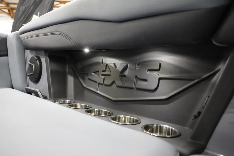 Slide: The Image of 2024 Axis T250 interior with logo and cup holders, showcasing sleek design and functionality. - 16