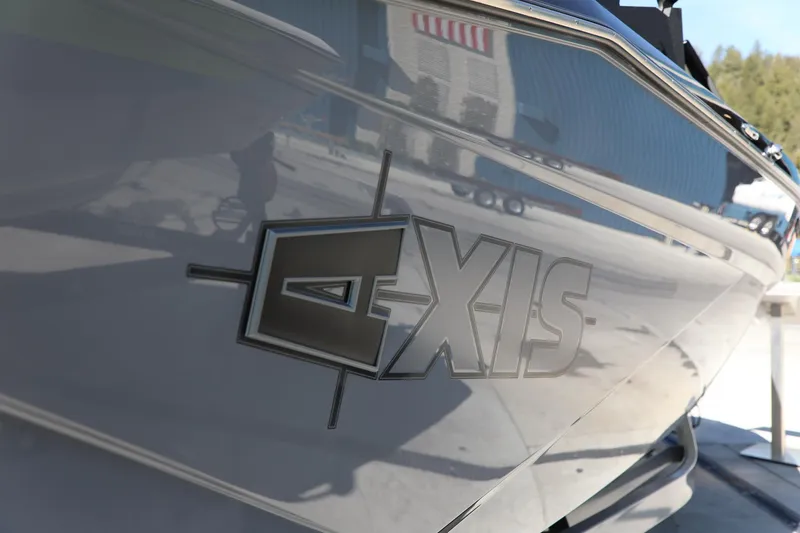 Slide: The Image of 2024 Axis T250 boat with sleek design and reflective surface. - 5